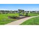 Tranquil community greenspace with a swing and landscaping, perfect for relaxation and outdoor enjoyment at 2438 Polaris Path, Myrtle Beach, SC 29577