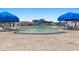 Large community pool with comfortable lounge chairs and umbrellas for relaxation and recreation at 2438 Polaris Path, Myrtle Beach, SC 29577