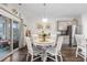 Cozy dining area with a round table and sliding glass doors to the patio, perfect for Gathering meals and gatherings at 2438 Polaris Path, Myrtle Beach, SC 29577