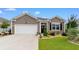 Charming home exterior with a well-manicured lawn and landscaping, highlighting its curb appeal and welcoming entrance at 2438 Polaris Path, Myrtle Beach, SC 29577