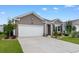 Charming home with a well-manicured lawn, a two-car garage, and a welcoming facade at 2438 Polaris Path, Myrtle Beach, SC 29577