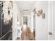 Inviting hallway with wood floors and decor that leads to the living areas, providing a welcoming entrance to the home at 2438 Polaris Path, Myrtle Beach, SC 29577