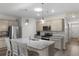 Bright kitchen with stainless steel appliances, gray cabinets, and granite countertops, ready for cooking and entertaining at 2438 Polaris Path, Myrtle Beach, SC 29577