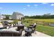 Outdoor patio with a fire pit and seating area, ideal for relaxing outdoors at 2438 Polaris Path, Myrtle Beach, SC 29577