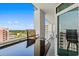 This is a balcony with chairs and a table with a view of the city at 2504 N Ocean Blvd. # 1936, Myrtle Beach, SC 29577