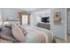 Bedroom featuring a queen bed, coastal decor, and a dresser with a TV for relaxing evenings at 2504 N Ocean Blvd. # 1936, Myrtle Beach, SC 29577