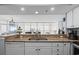 Open kitchen featuring granite countertops, a stainless steel sink, and a breakfast bar overlooking the living area at 2504 N Ocean Blvd. # 1936, Myrtle Beach, SC 29577