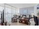 Bright living room with modern furnishings and floor-to-ceiling windows providing natural light at 2504 N Ocean Blvd. # 1936, Myrtle Beach, SC 29577