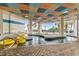 Beautiful indoor pool area with lazy river, lounge chairs, and covered seating at 2504 N Ocean Blvd. # 1936, Myrtle Beach, SC 29577