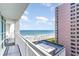 Lovely balcony view featuring a glimpse of the ocean, a pink high-rise building, and outdoor seating, great for leisure at 2504 N Ocean Blvd. # 936, Myrtle Beach, SC 29577