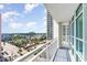 Expansive balcony view overlooking a vibrant cityscape with palm trees and distant buildings, offering a serene outdoor space at 2504 N Ocean Blvd. # 936, Myrtle Beach, SC 29577