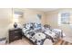 Cozy bedroom featuring a queen-sized bed, neutral walls, and natural light from the window at 2504 N Ocean Blvd. # 936, Myrtle Beach, SC 29577