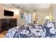 Bedroom featuring a queen bed, television, dresser, and an attached bathroom at 2504 N Ocean Blvd. # 936, Myrtle Beach, SC 29577