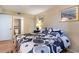 The bedroom includes a bed with a floral comforter and an attached bathroom at 2504 N Ocean Blvd. # 936, Myrtle Beach, SC 29577