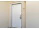 Neutral-colored condo front door with brushed metal handle, peep hole, and unit number display at 2504 N Ocean Blvd. # 936, Myrtle Beach, SC 29577
