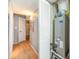 Hallway featuring light wooden floors, neutral paint and doors, and the HVAC closet at 2504 N Ocean Blvd. # 936, Myrtle Beach, SC 29577