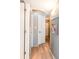 This hallway has wooden flooring, white doors, and framed artwork on the walls at 2504 N Ocean Blvd. # 936, Myrtle Beach, SC 29577