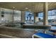 Inviting indoor pool area with ample seating, natural light, and stylish tile flooring at 2504 N Ocean Blvd. # 936, Myrtle Beach, SC 29577