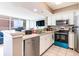 Well-equipped kitchen with white cabinetry and stainless steel appliances at 2504 N Ocean Blvd. # 936, Myrtle Beach, SC 29577