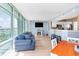 Bright living room with a fireplace, TV, and large windows offering beautiful views at 2504 N Ocean Blvd. # 936, Myrtle Beach, SC 29577