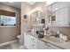 Bathroom with double vanity, granite countertop and two mirrored medicine cabinets at 2611 Ringneck Trail, Myrtle Beach, SC 29588