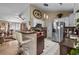 Open kitchen with stainless steel appliances, tile backsplash, and breakfast bar seating at 2611 Ringneck Trail, Myrtle Beach, SC 29588