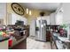 A functional kitchen with stainless steel appliances, granite counters, tile backsplash and ample cabinet space at 2611 Ringneck Trail, Myrtle Beach, SC 29588