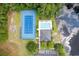 Aerial view of the community pool, tennis court, and adjacent pond, offering a serene setting at 2783 Sanctuary Blvd., Conway, SC 29526