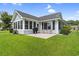 A view of a well maintained backyard that has a grilling and outdoor seating area on a sunny day at 2783 Sanctuary Blvd., Conway, SC 29526