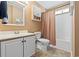 Clean bathroom featuring a single vanity, toilet, and shower with curtain at 2783 Sanctuary Blvd., Conway, SC 29526