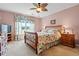 Inviting bedroom with floral bedding, soft lighting, and a peaceful ambiance at 2783 Sanctuary Blvd., Conway, SC 29526