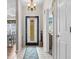 An entryway with tile flooring, a decorative front door, and a view into the dining room at 2783 Sanctuary Blvd., Conway, SC 29526