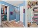 Hallway leading to closets, featuring wood-look flooring and neutral walls at 2783 Sanctuary Blvd., Conway, SC 29526