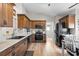 Spacious kitchen featuring stainless steel appliances, wood cabinets, and light countertops at 2783 Sanctuary Blvd., Conway, SC 29526