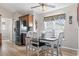 A view of a kitchen and dining area with a ceiling fan, stainless appliances, and wood flooring at 2783 Sanctuary Blvd., Conway, SC 29526