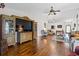 Spacious living room with hardwood floors, large TV, and elegant decor at 2783 Sanctuary Blvd., Conway, SC 29526