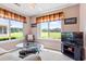 Comfortable living room with scenic views, a glass table, and a TV at 2783 Sanctuary Blvd., Conway, SC 29526