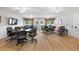 Large community room featuring tables, chairs, ceiling fans, and ample space for gatherings at 2783 Sanctuary Blvd., Conway, SC 29526