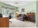 Bright office space with desk, cozy seating, and large bay windows at 2783 Sanctuary Blvd., Conway, SC 29526
