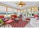 Bright sunroom with large windows offering beautiful views and comfortable seating at 2783 Sanctuary Blvd., Conway, SC 29526