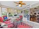 Cozy sunroom featuring bright windows, comfortable seating, and a view to the outside at 2783 Sanctuary Blvd., Conway, SC 29526