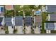 Overhead aerial shot of coastal neighborhood featuring backyard pools, palm trees, and well-kept lawns at 304 62Nd Ave N 62Nd Ave. N, North Myrtle Beach, SC 29582