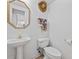 Charming half-bathroom featuring pedestal sink, decorative mirror, and whimsical decor at 304 62Nd Ave N 62Nd Ave. N, North Myrtle Beach, SC 29582