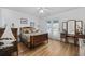 Cozy bedroom featuring hardwood floors, neutral walls, and a french door exit at 304 62Nd Ave N 62Nd Ave. N, North Myrtle Beach, SC 29582