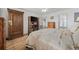 Bedroom features a wooden armoire, natural light, and access to the backyard at 304 62Nd Ave N 62Nd Ave. N, North Myrtle Beach, SC 29582