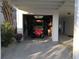 Garage featuring a red golf cart and ample storage space, providing convenience and organization at 304 62Nd Ave N 62Nd Ave. N, North Myrtle Beach, SC 29582