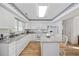 Well-lit kitchen with granite countertops, white cabinetry, and modern appliances at 304 62Nd Ave N 62Nd Ave. N, North Myrtle Beach, SC 29582