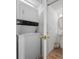 Laundry area with stacked washer and dryer, and a nearby pedestal sink bathroom at 304 62Nd Ave N 62Nd Ave. N, North Myrtle Beach, SC 29582