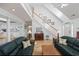 Bright living room features a staircase, hardwood floors, and comfortable seating at 304 62Nd Ave N 62Nd Ave. N, North Myrtle Beach, SC 29582