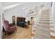 Bright living room with vaulted ceilings, hardwood floors, and staircase to upper level at 304 62Nd Ave N 62Nd Ave. N, North Myrtle Beach, SC 29582